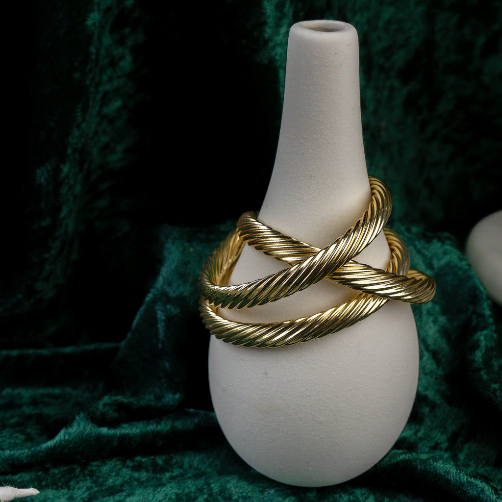 Close-up of three Twisted Gold Bangle showing lines